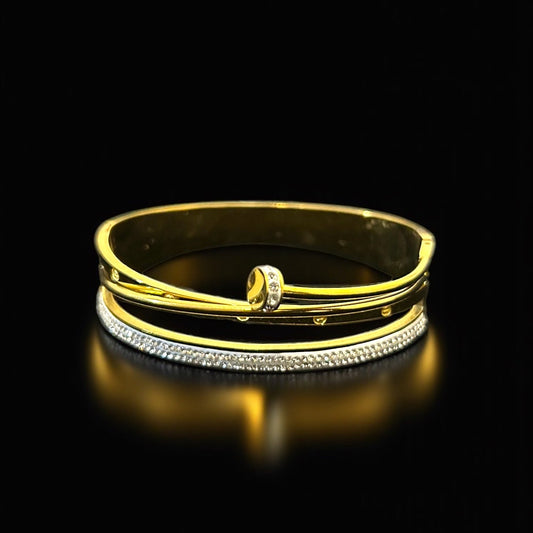 Gold and silver anti tarnish bracelet on a black background