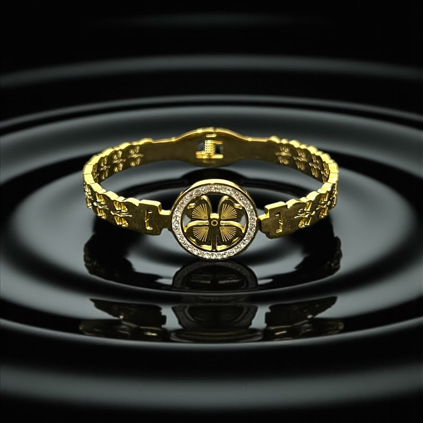 Anti tarnish Gold Colour Bracelet with a four-leaf clover design on a black background