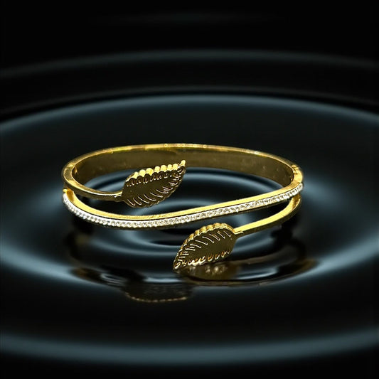 Anti tarnish Gold colour bracelet with leaf designs on a dark water surface