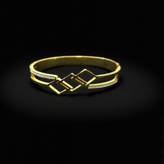 Gold bracelet with a black background